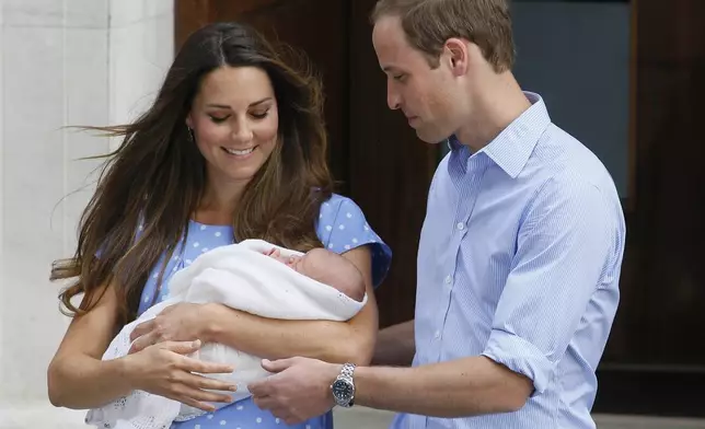 Britain's Prince William, right, and Kate, Duchess of Cambridge, hold the Prince of Cambridge, July 23, 2013, as they pose for the media outside St. Mary's Hospital's exclusive Lindo Wing in London, where the Duchess gave birth on July 22. (AP Photo/Kirsty Wigglesworth, File)
