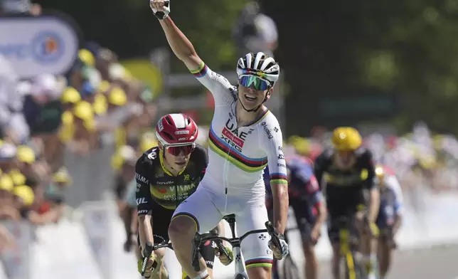 Slovenia's Tadej Pogacar celebrates as he crosses the finish line to win the seventh stage of the Tour de France cycling race over 197 kilometers (122.4 miles) with start in Saint-Malo and finish in Mur-de-Bretagne Guerledan, France, Friday, July 11, 2025. (AP Photo/Thibault Camus)