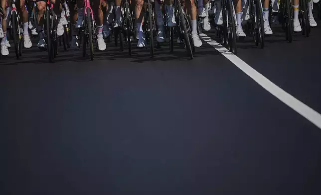 The pack rides during the fourth stage of the Tour de France cycling race over 172.2 kilometers (107 miles) with start in Amiens and finish in Rouen, France, Tuesday, July 8, 2025. (AP Photo/Thibault Camus)