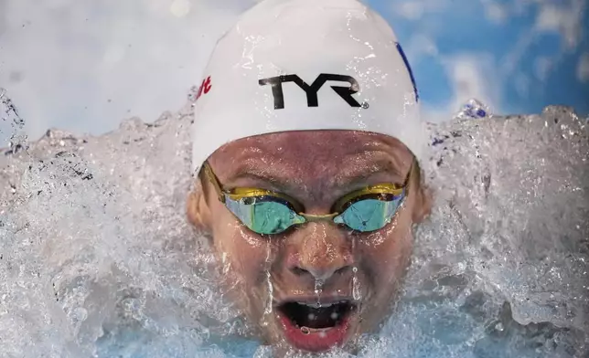 Leon Marchand of France competes in the men's 200-meter individual medley final at the World Aquatics Championships in Singapore, Thursday, July 31, 2025. (AP Photo/Vincent Thian)