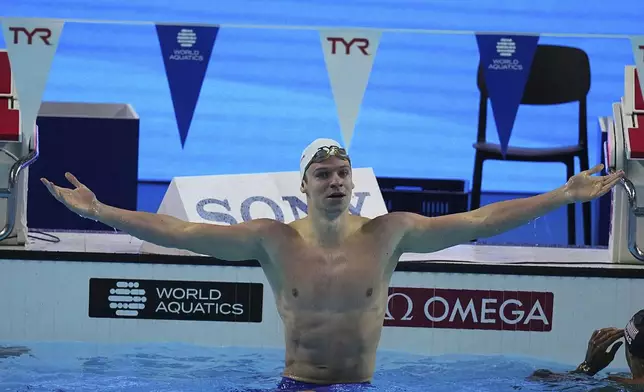 Leon Marchand of France celebrates after competing in the men's 200-meter individual medley semifinals at the World Aquatics Championships in Singapore, Wednesday, July 30, 2025. (AP Photo/Ng Han Guan)