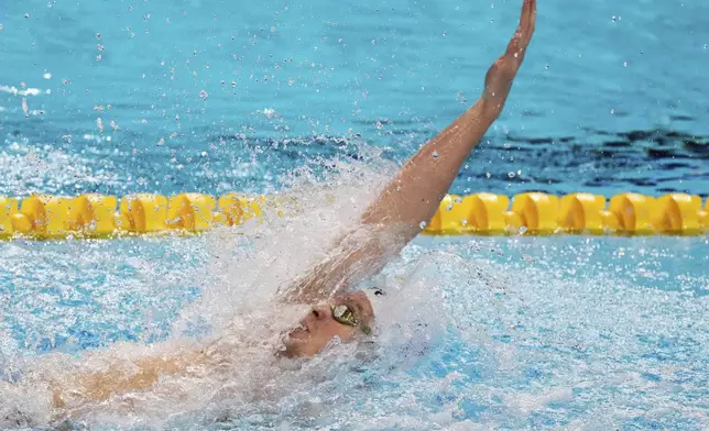Leon Marchand of France competes in the men's 200-meter individual medley final at the World Aquatics Championships in Singapore, Thursday, July 31, 2025. (AP Photo/Lee Jin-man)