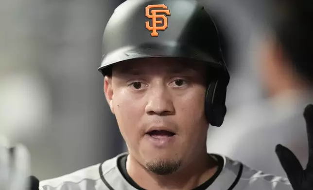 San Francisco Giants' Wilmer Flores (41) celebrates after hitting a three-run home run against the Atlanta Braves inning of a baseball game, Tuesday, July 22, 2025, in Atlanta. (AP Photo/Mike Stewart)