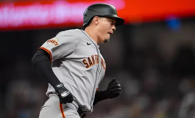 San Francisco Giants' Wilmer Flores (41) rounds the bases after hitting a three-run home run against the Atlanta Braves inning of a baseball game, Tuesday, July 22, 2025, in Atlanta. (AP Photo/Mike Stewart)