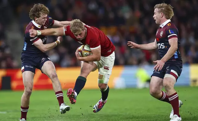 Jac Morgan of the British &amp; Irish Lions runs at the defence during their game against the Queensland Reds in Brisbane, Australia, Wednesday, July 2, 2025. (AP Photo/Pat Hoelscher)