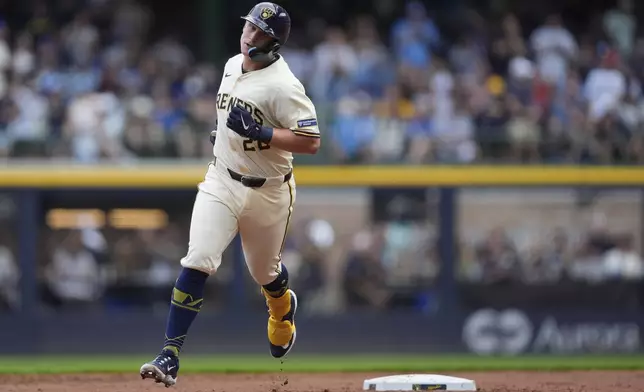 Milwaukee Brewers' Andrew Vaughn rounds the bases after hitting a three-run home run during the first inning of a baseball game against the Los Angeles Dodgers, Monday, July 7, 2025, in Milwaukee. (AP Photo/Aaron Gash)