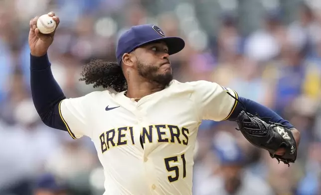 Milwaukee Brewers' Freddy Peralta pitches during the first inning of a baseball game against the Los Angeles Dodgers, Monday, July 7, 2025, in Milwaukee. (AP Photo/Aaron Gash)