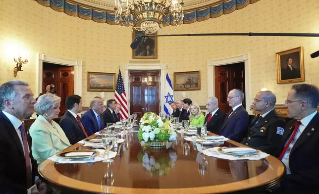 President Donald Trump, fourth from left, meets with Israel's Prime Minister Benjamin Netanyahu, fourth from right, as White House special envoy Steve Witkoff, from left, White House Chief of Staff Susie Wiles, Secretary of State Marco Rubio, Defense Secretary Pete Hegseth, obstructed, CIA Director John Ratcliffe and U.S. Ambassador to Israel Mike Huckabee listen in the Blue Room of the White House, Monday, July 7, 2025, in Washington. (AP Photo/Alex Brandon)