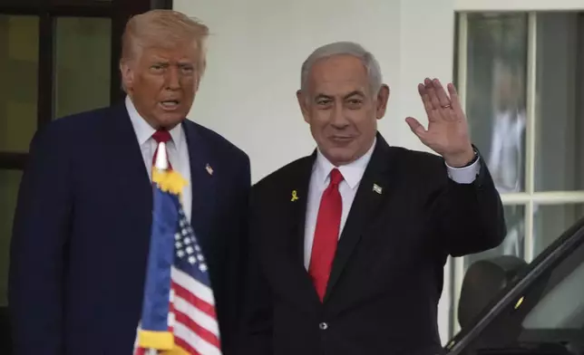 FILE - Israel's Prime Minister Benjamin Netanyahu, right, is greeted by President Donald Trump as he arrives at the West Wing of the White House in Washington, April 7, 2025, in Washington. (AP Photo/Mark Schiefelbein, File)