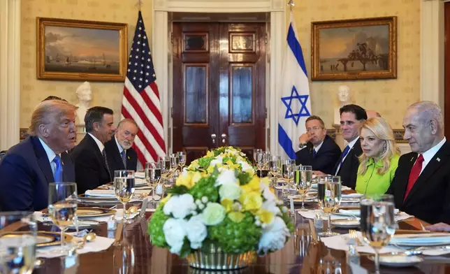 President Donald Trump, left, meets with Israel's Prime Minister Benjamin Netanyahu, right, in the Blue Room of the White House, Monday, July 7, 2025, in Washington. (AP Photo/Alex Brandon)