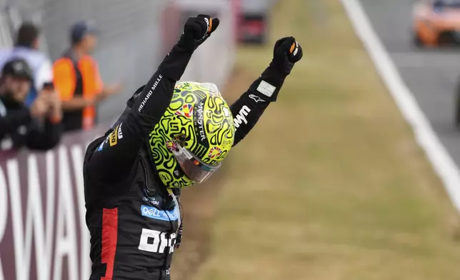 McLaren driver Lando Norris of Britain celebrates winning the British Formula One Grand Prix race at the Silverstone racetrack in Silverstone, England, Sunday, July 6, 2025. (AP Photo/Darko Bandic)