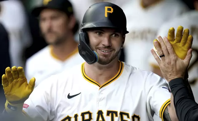 Pittsburgh Pirates' Spencer Horwitz celebrates in the dugout after hitting a home run off St. Louis Cardinals pitcher Erick Fedde during the first inning of a baseball game, Monday, June 30, 2025, in Pittsburgh. (AP Photo/Matt Freed)