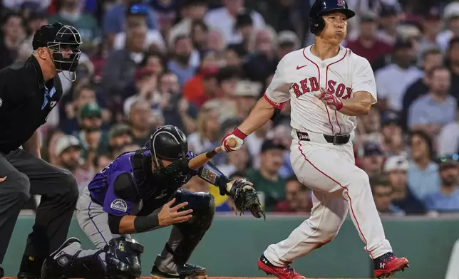 Boston Red Sox designated hitter Masataka Yoshida watches his RBI single during the fourth inning of a baseball game against the Colorado Rockies at Fenway Park, Wednesday, July 9, 2025, in Boston. (AP Photo/Charles Krupa)