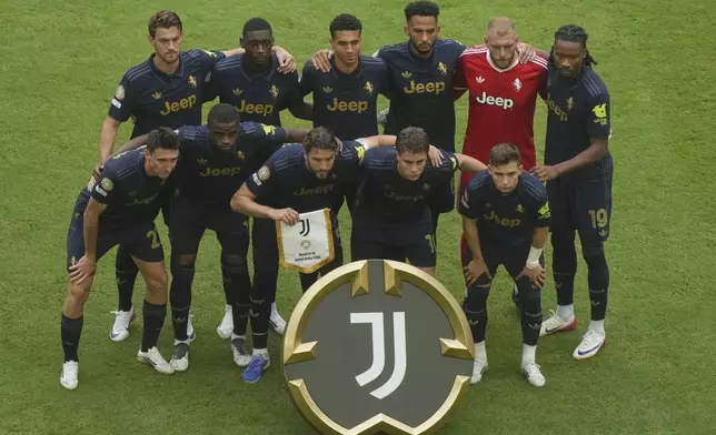 Juventus' starting 11 pose before the Club World Cup round of 16 soccer match between Real Madrid and Juventus in Miami Gardens, Fla., Tuesday, July 1, 2025. (AP Photo/Marta Lavandier)