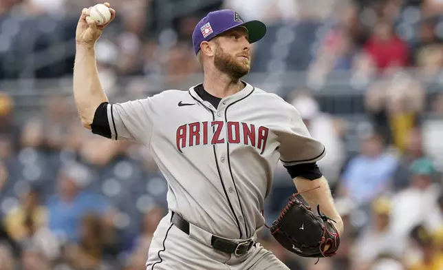 Arizona Diamondbacks pitcher Merrill Kelly delivers during the first inning of a baseball game against the Pittsburgh Pirates, Saturday, July 26, 2025, in Pittsburgh. (AP Photo/Matt Freed)