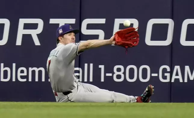 Arizona Diamondbacks center fielder Corbin Carroll catches a fly ball hit by Pittsburgh Pirates' Ke'Bryan Hayes during the fourth inning of a baseball game Saturday, July 26, 2025, in Pittsburgh. (AP Photo/Matt Freed)