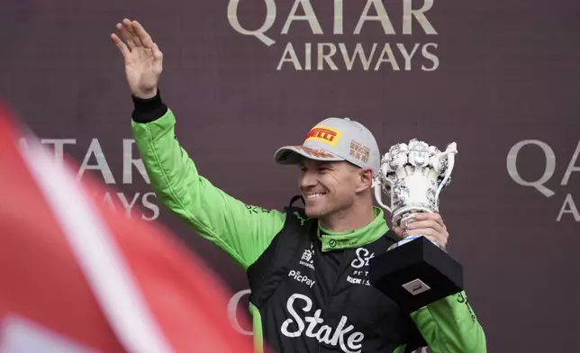 Kick Sauber driver Nico Hulkenberg of Germany holds the trophy as he celebrates 3rd position during the British Formula One Grand Prix race at the Silverstone racetrack in Silverstone, England, Sunday, July 6, 2025. (AP Photo/Darko Bandic)