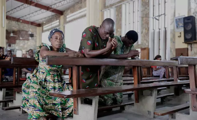 Relatives of the late 15-year old Jacques Koami Koutoglo, attend a prayer service at a church in Lome, Togo, Monday, July 7, 2025. (AP Photo/Erick Kaglan)