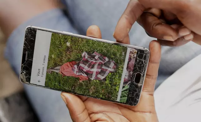 Koutoglo Kossi Mawuli, the uncle of late 15-year-old Jacques Koami Koutoglo, shows a photograph of his body on a mobile phone after it was recovered from a lagoon in Lome, Togo, Tuesday, July 8, 2025. (AP Photo/Erick Kaglan)