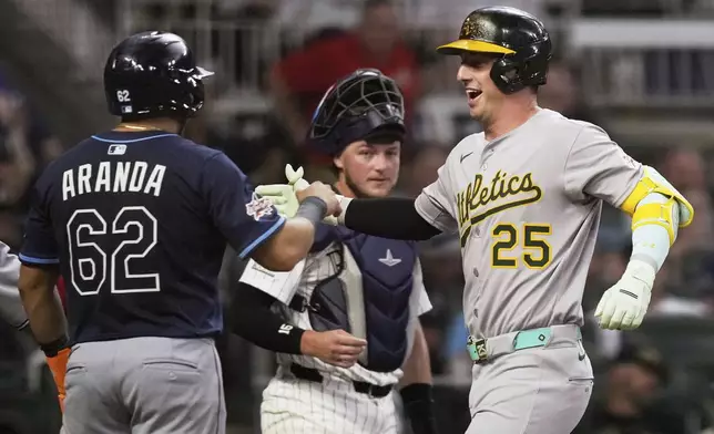 Athletics' Brent Rooker celebrates his home run during seventh inning at the MLB baseball All-Star game between the American League and National League, Tuesday, July 15, 2025, in Atlanta. (AP Photo/Brynn Anderson)