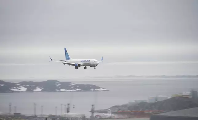 The first direct scheduled flight from Newark in the USA to Nuuk lands at the airport in Nuuk, Greenland, on Saturday, June 14, 2025. (AP Photo/Kwiyeon Ha)