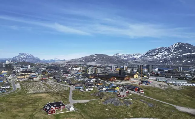 Houses in Nuuk, Greenland, Sunday, June 22, 2025. (AP Photo/Kwiyeon Ha)