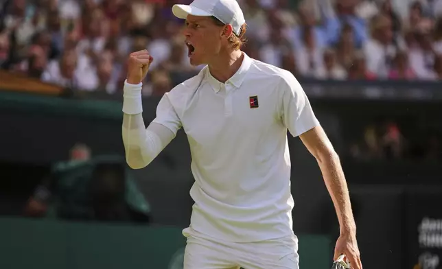 Jannik Sinner of Italy reacts after winning a point during the men's singles final match against Carlos Alcaraz of Spain at the Wimbledon Tennis Championships in London, Sunday, July 13, 2025.(AP Photo/Kirsty Wigglesworth)