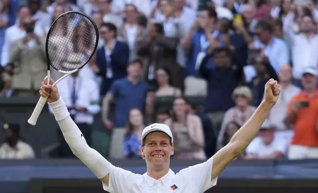 Jannik Sinner of Italy celebrates after winning the men's singles final match against Carlos Alcaraz of Spain at the Wimbledon Tennis Championships in London, Sunday, July 13, 2025.(AP Photo/Kirsty Wigglesworth)