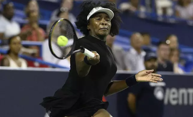 Venus Williams returns the ball against Peyton Stearns during a match at the Citi Open tennis tournament Tuesday, July 22, 2025, in Washington. (AP Photo/Nick Wass)