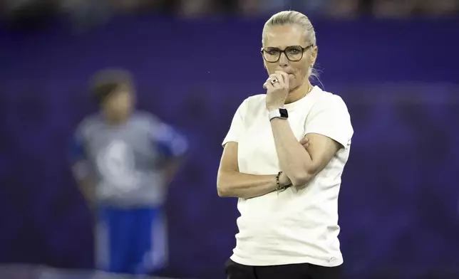 England's head coach Sarina Wiegman watches during the Women's Euro 2025 quarterfinals soccer match between Sweden and England at Stadion Letzigrund in Zurich, Switzerland, Thursday, July 17, 2025. (Michael Buholzer/Keystone via AP)