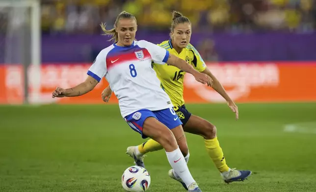 Sweden's Filippa Angeldahl, right, challenges England's Georgia Stanway during the Women's Euro 2025 quarterfinals soccer match between Sweden and England at Stadion Letzigrund in Zurich, Switzerland, Thursday, July 17, 2025. (AP Photo/Martin Meissner)