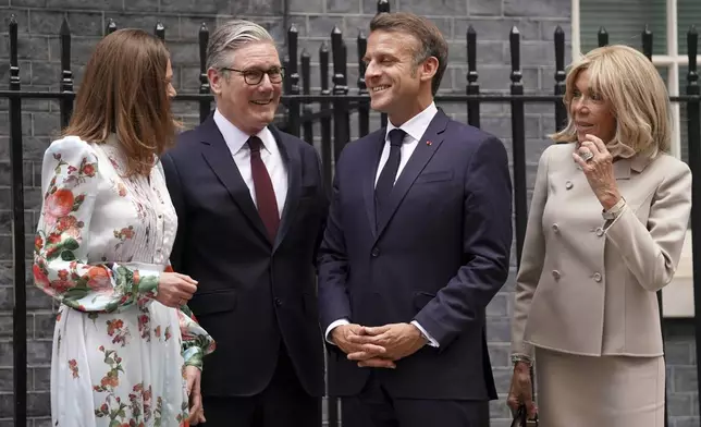 Britain's Prime Minister Keir Starmer and wife Victoria welcome French President Emmanuel Macron and wife Brigitte to 10 Downing Street in London, Wednesday, July 9, 2025.(AP Photo/Alberto Pezzali, Pool)