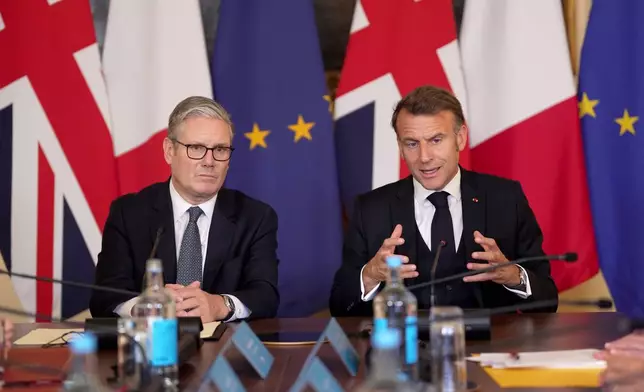 Britain's Prime Minister Keir Starmer, left, and French President Emmanuel Macron attend a plenary at the UK-France Summit in Downing Street, London Thursday, July 10, 2025. (Yui Mok/Pool Photo via AP)