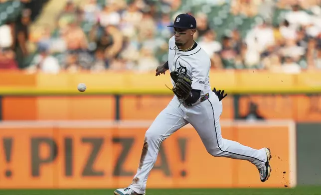 Detroit Tigers shortstop Javier Baez fields a ground ball hit by Arizona Diamondbacks' Alek Thomas who was out at first base during the fifth inning of a baseball game Monday, July 28, 2025, in Detroit. (AP Photo/Ryan Sun)