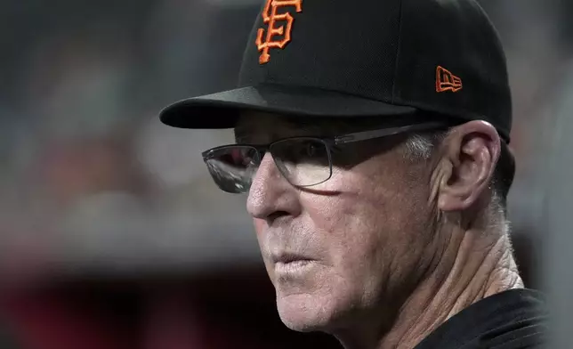 San Francisco Giants manager Bob Melvin watches action against the Arizona Diamondbacks in the first inning during a baseball game, Tuesday, July 1, 2025, in Phoenix. (AP Photo/Rick Scuteri)
