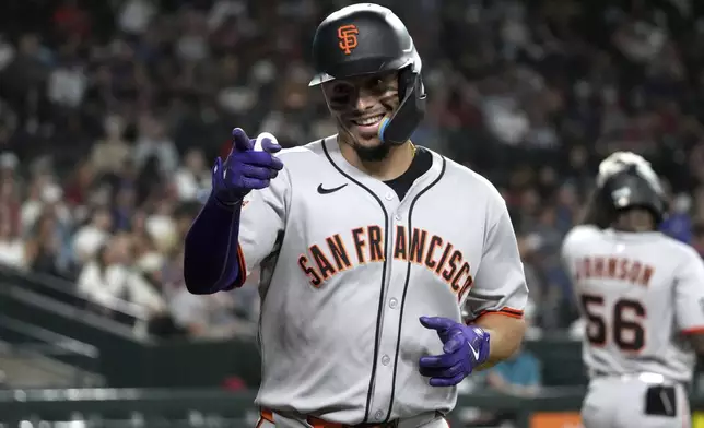San Francisco Giants' Willy Adames reacts after hitting a solo home run against the Arizona Diamondbacks in the first inning during a baseball game, Tuesday, July 1, 2025, in Phoenix. (AP Photo/Rick Scuteri)