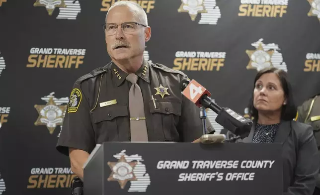 Grand Traverse County Sheriff Mike Shea, left, speaks alongside Prosecutor Noelle Moeggenberg during a news conference Sunday, July 27, 2025, after 11 people were stabbed at a Walmart in Traverse City, Mich. (AP Photo/Ryan Sun)