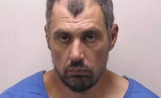 This photo provided by the Grand Traverse County Sheriff's Office on Sunday, July 27, 2025, shows Bradford Gille, who is accused of stabbing 11 people at a Walmart on Saturday, July 26, in Traverse City, Mich. (Grand Traverse County Sheriff's Office via AP)