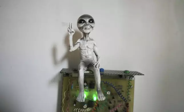 An alien figure is displayed during an exhibition held as part of the Indonesia UFO Festival in Yogyakarta, Indonesia,Friday, July 25, 2025. (AP Photo/Dita Alangkara)