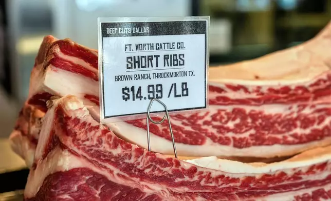 Several pounds of short ribs show the price per pound at Deep Cuts Dallas Butcher Shop, Thursday, July 24, 2025, in Dallas. (AP Photo/Tony Gutierrez)