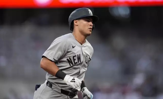 New York Yankees' Anthony Volpe (11) rounds the bases after hitting a two-run home run against the Atlanta Braves inning of a baseball game, Saturday, July 19, 2025, in Atlanta. (AP Photo/Mike Stewart)