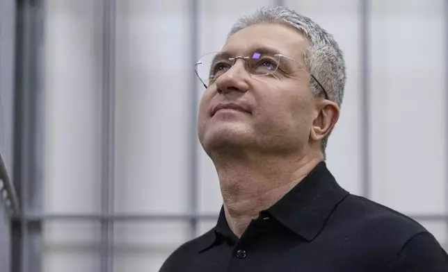 Timur Ivanov, Russia's former deputy defense minister facing corruption charges, stands in the defendant's cage before a hearing, in the Moscow City Court in Moscow, Russia, Tuesday, July 1, 2025. (AP Photo)
