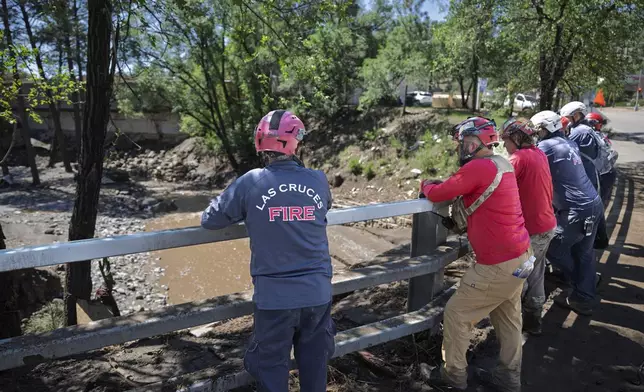 Rescue Personnel from Las Cruces, N.M., as well as the surrounding areas standby in the town of Ruidoso, N.M., as they expect rain later in the forecast, Wednesday, July 9, 2025, after the town got hit with a major flooding the day before. (AP Photo/Roberto E. Rosales)