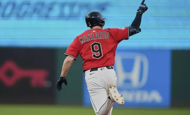 Cleveland Guardians' Kyle Manzardo (9) gestures as he runs the bases with a home run in the fifth inning of a baseball game against the Baltimore Orioles in Cleveland, Monday, July 21, 2025. (AP Photo/Sue Ogrocki)