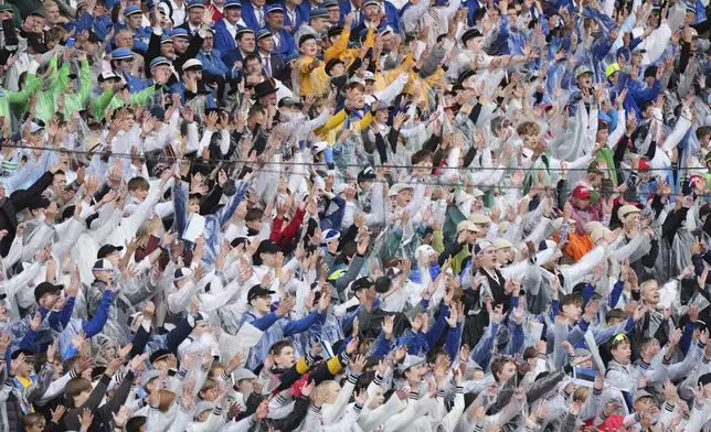 Choir singers attend the "Iseoma" Song and Dance Celebration at the Song Festival Grounds in Tallinn, Estonia, on Sunday, July 6, 2025. (AP Photo/Sergei Grits)