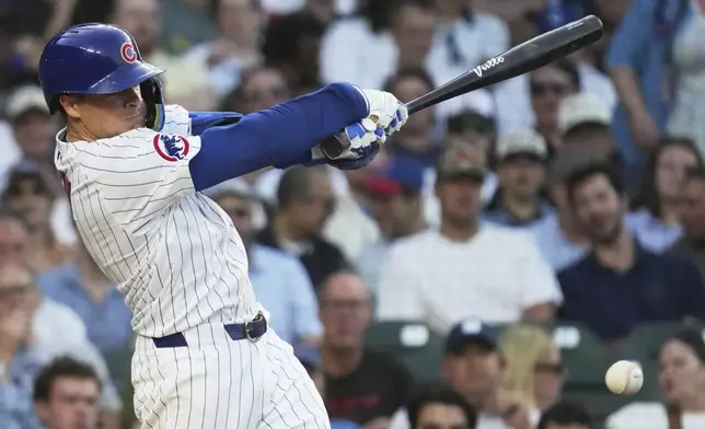 Chicago Cubs' Matt Shaw hits a one-run single during the second inning of a baseball game against the Kansas City Royals in Chicago, Tuesday, July 22, 2025. (AP Photo/Nam Y. Huh)