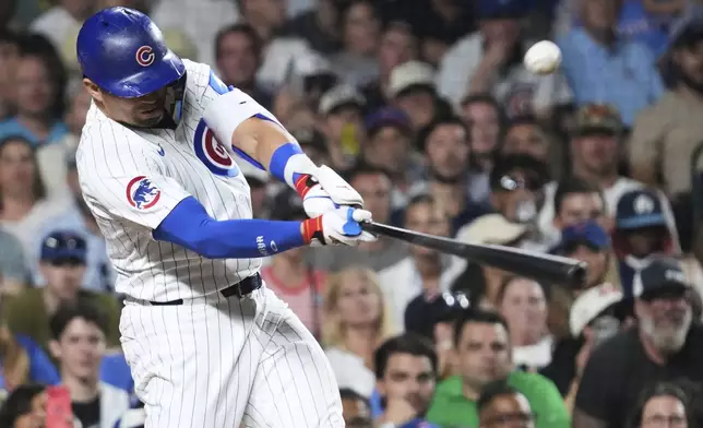Chicago Cubs' Seiya Suzuki, of Japan, hits a one-run single during the seventh inning of a baseball game against the Kansas City Royals in Chicago, Tuesday, July 22, 2025. (AP Photo/Nam Y. Huh)