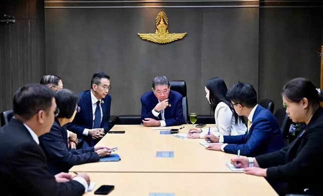 This image provided by the Thai Prime MInister's Office shows Thailand's Acting Prime Minister Phumtham Wechayachai, center, with his staff listening during his phone call with U.S. President Donald Trump, in Bangkok on Monday July 28, 2025, after returning from Malaysia, where he met Cambodian Prime Minister Hun Manet for peace talks which resulted in a ceasefire in the two nations' five days of fighting along their border over a territorial dispute. (Thai Prime MInister's Office via AP)