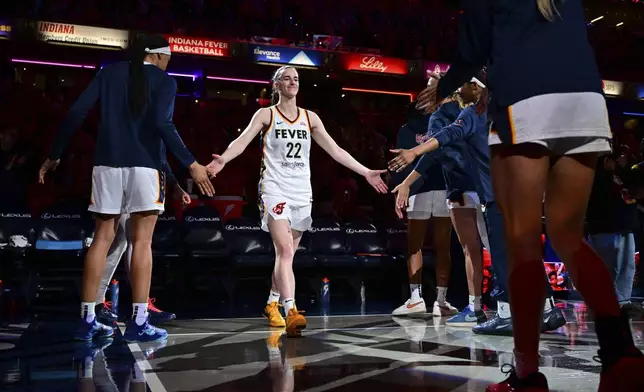Indiana Fever's Caitlin Clark (22) is introduced before a WNBA basketball game against Golden State Valkyries, Wednesday, July 9, 2025, in Indianapolis. (AP Photo/Doug McSchooler)