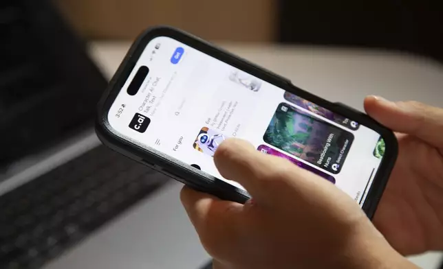 Bruce Perry, 17, demonstrates Character AI, an artificial intelligence chatbot software that allows users to chat with popular characters such as EVE from Disney's 2008 animated film, WALL-E, Tuesday, July 15, 2025, in Russellville, Ark. (AP Photo/Katie Adkins)